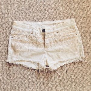 white embroidered cutoff shorts